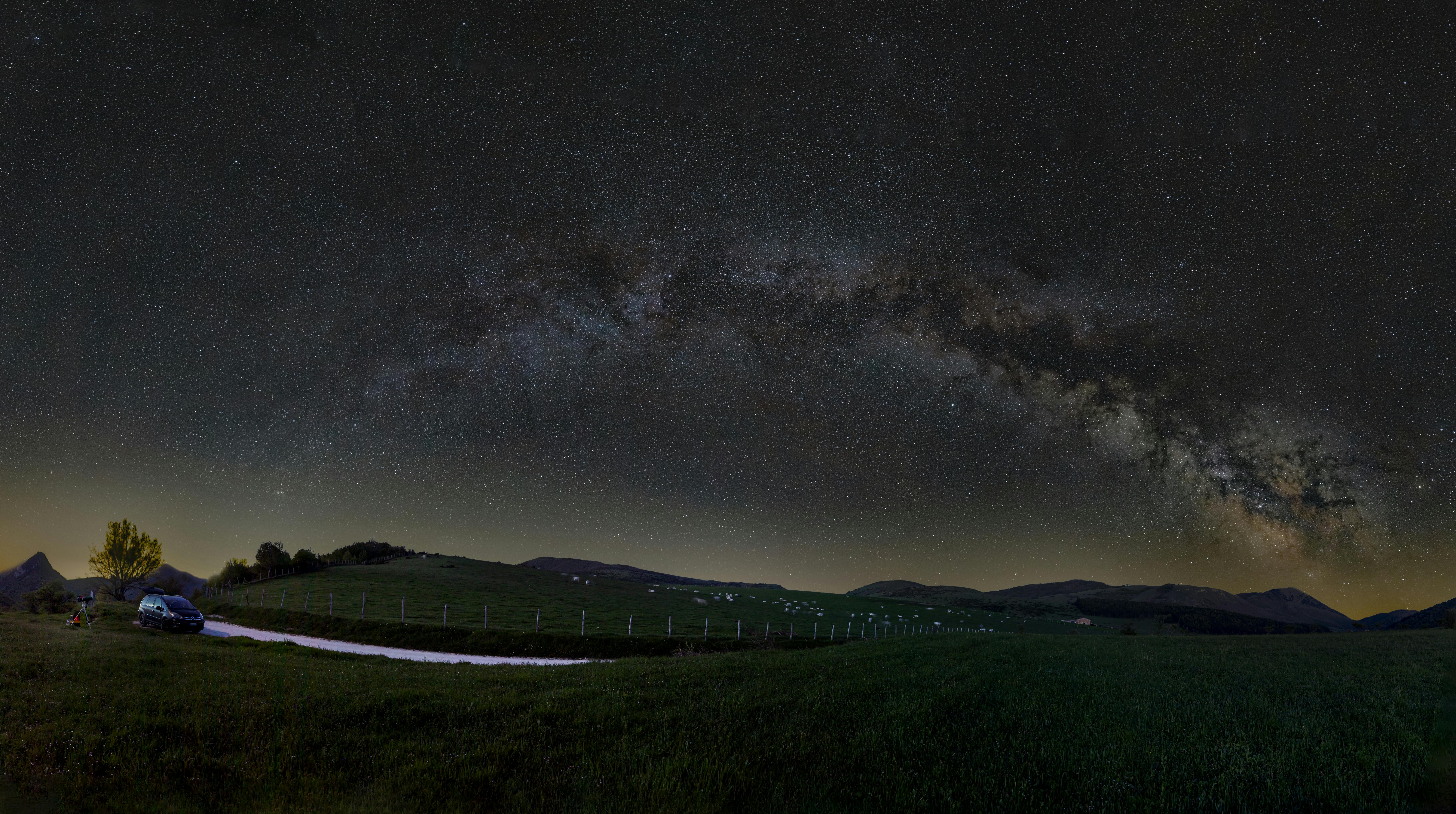 Abstract 3D digital landscape with glowing particles and neon lights